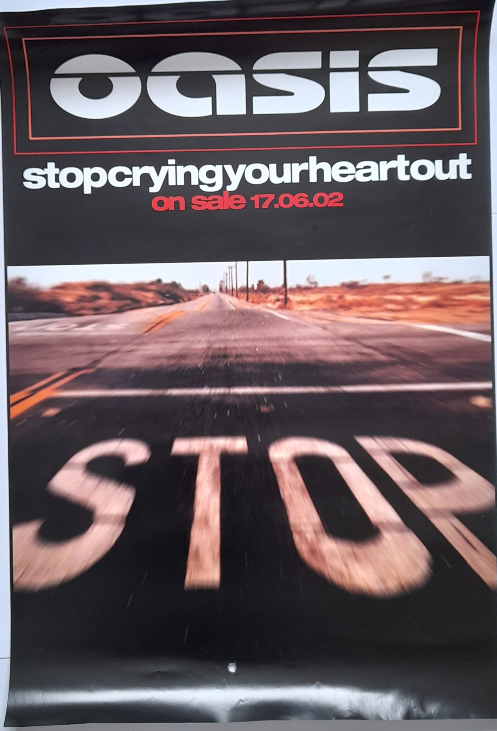 Oasis Stop Crying Your Heart Out Promotional Poster